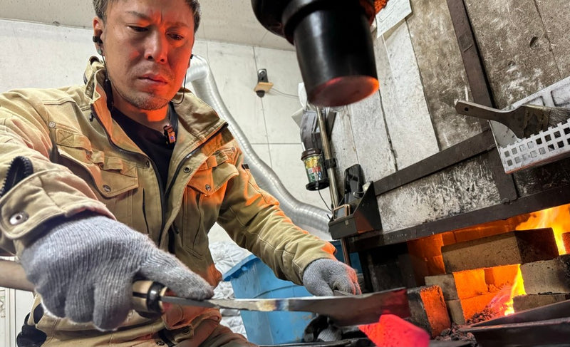 Nishida Hamono crafting a knife at the forge in their workshop