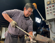 Master artisan at Sakoda Hamono crafting knives in his workshop