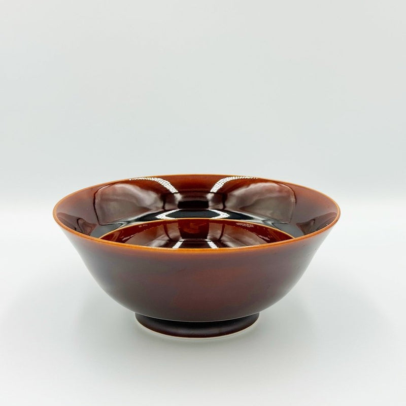 Side view showing inside of Amber Glazed Bowl crafted by Imari Togei craftsmen on light cream background