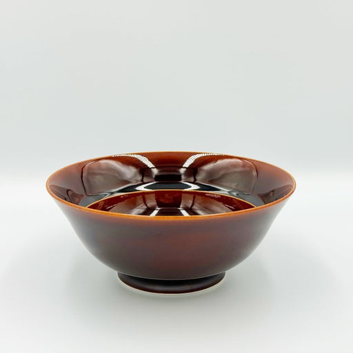 Side view showing inside of Amber Glazed Bowl crafted by Imari Togei craftsmen on light cream background