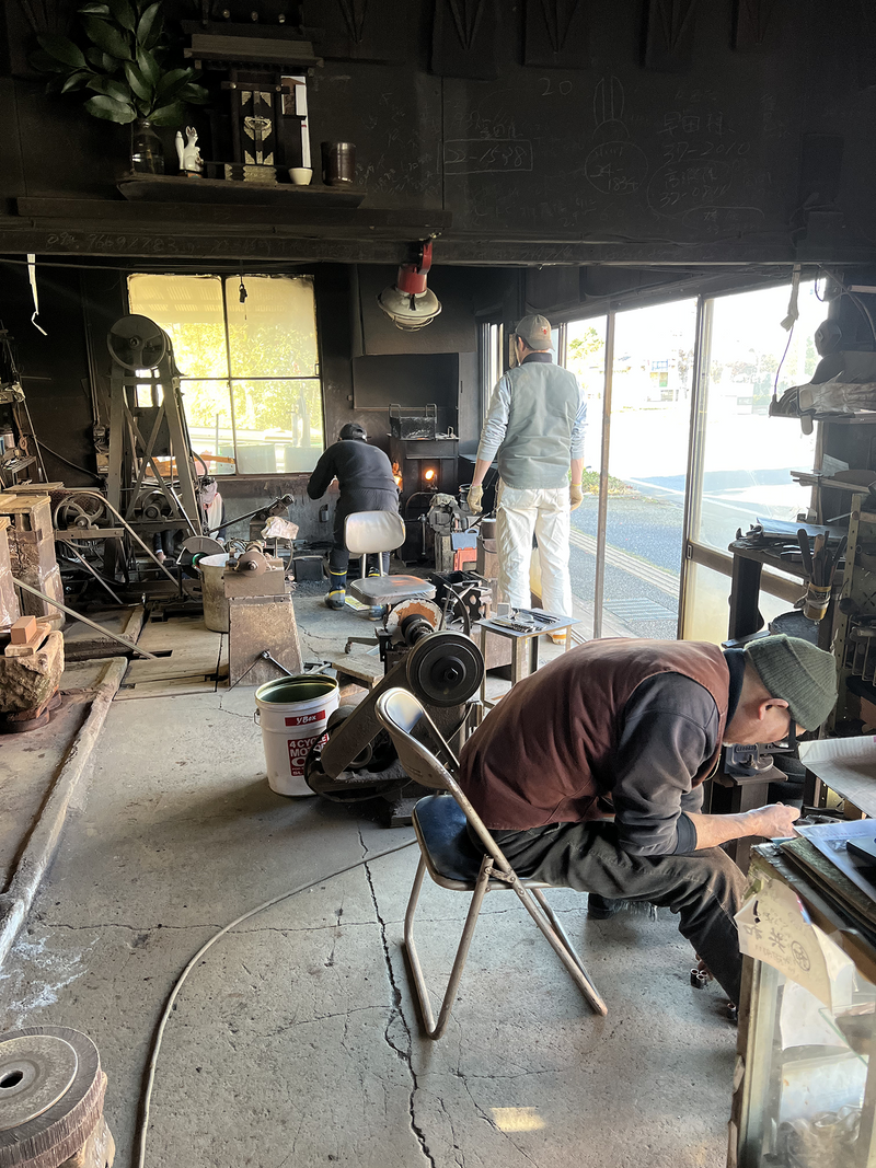 The three generations of Minomo Blacksmith working inside the workshop