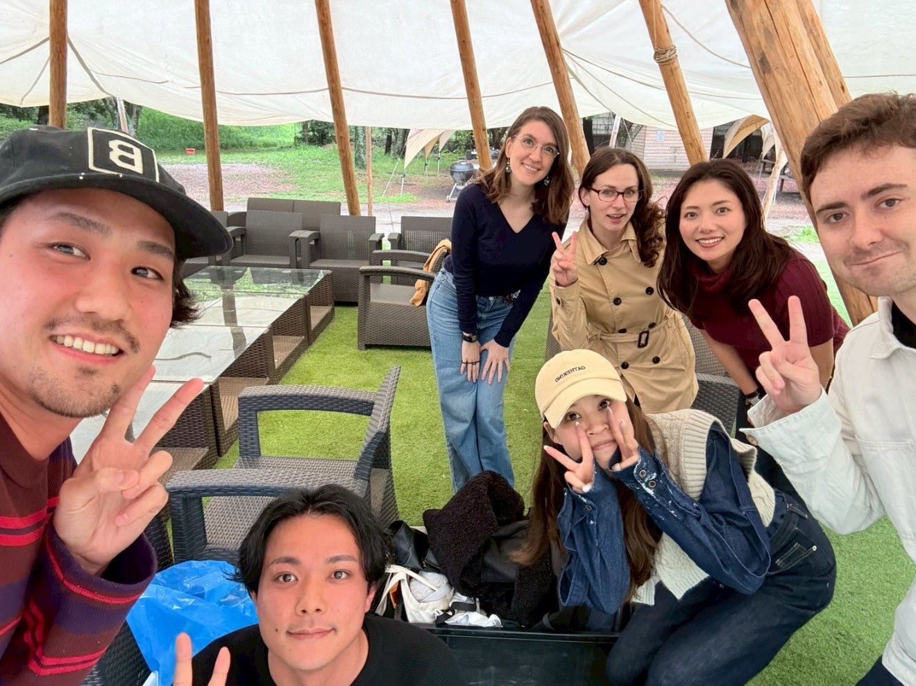 Group photo of the Japan Food Craftsman team withCEO Seiryu Sakoda on an outdoor tent