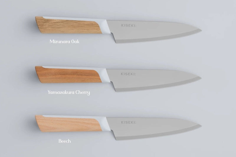 The 3 KISEKI Petty Knife variations (Mizunara Oak, Yamazakura Cherry and Beech) vertically aligned over a light grey background