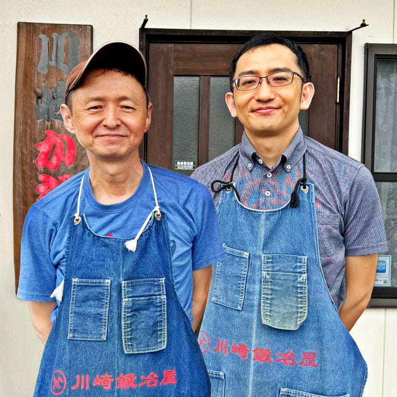 Kawasaki Blacksmith artisans posing in front of their workshop
