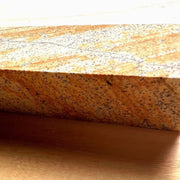 Closeup on natural red sharpening stone included with Kurouchi Gyuto and Petty Knives by Nishida Hamono
