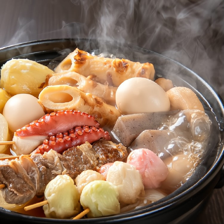 Oden in a pot and the steam is rising up.