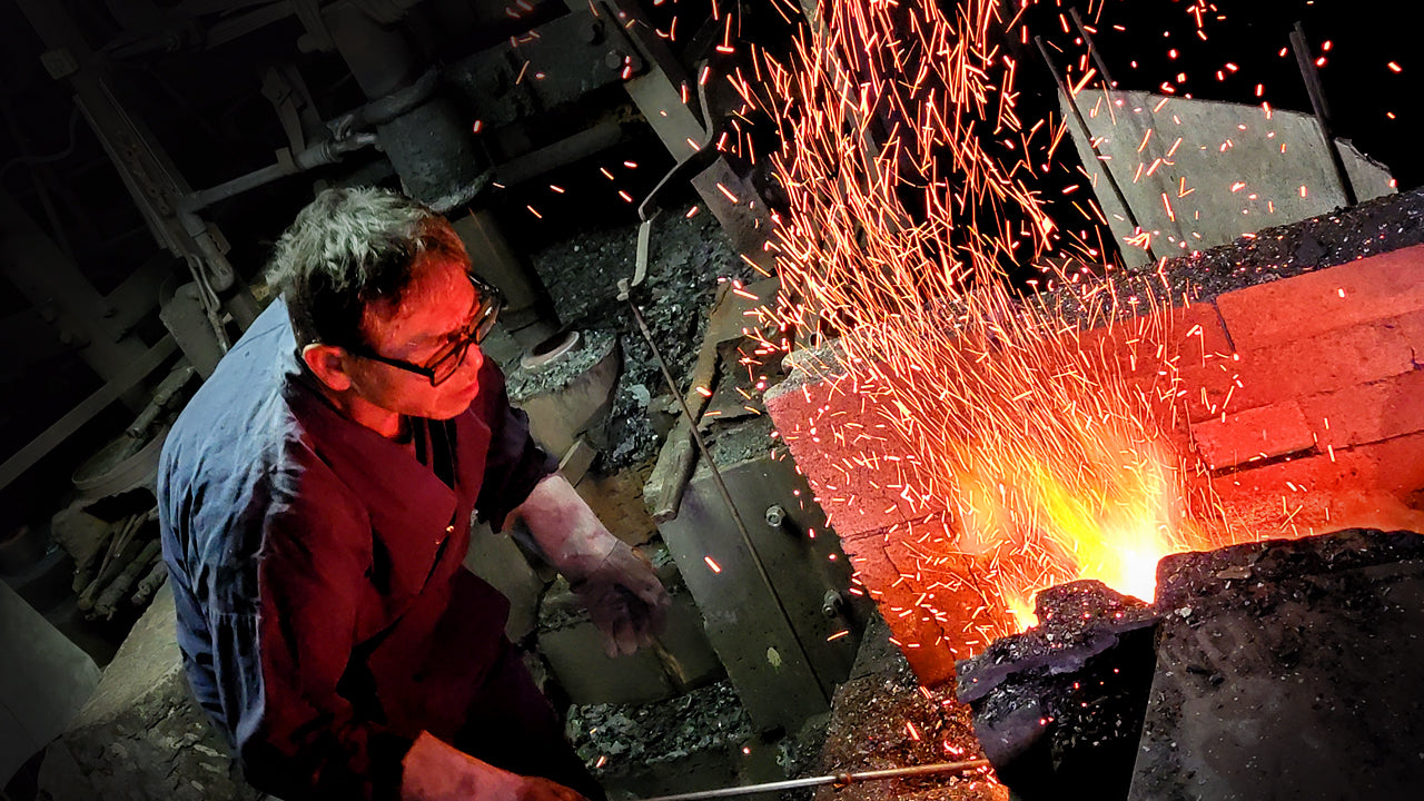 Shiro Kunimitsu master artisan dealing with the forge fire