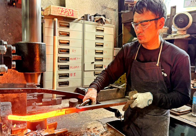 Satoshi Nakagawa from Nakagawa Knives heating the metal in the workshop