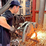 Nigara Hamono craftsman working in the workshop while sparks are flying when cutting the blade