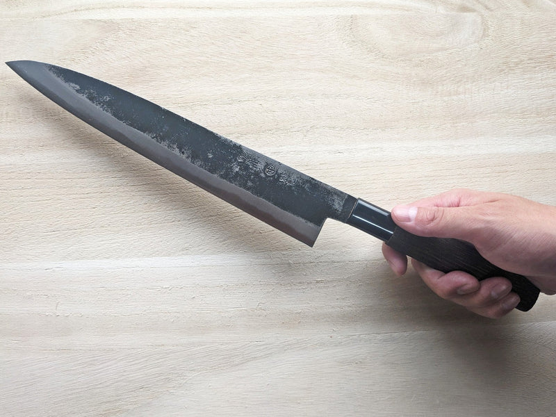Hand holding Sashimi Knife 240mm by Nakamura Hamono