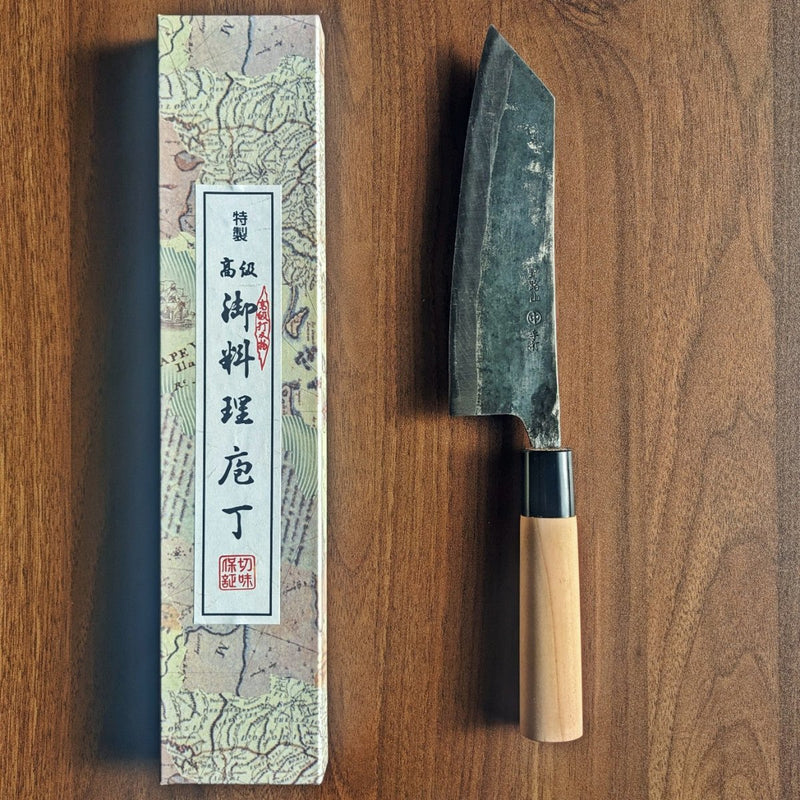 Bunka Kitchen Knife 180mm by Nakamura Hamono next to its box showing the label with Japanese characters