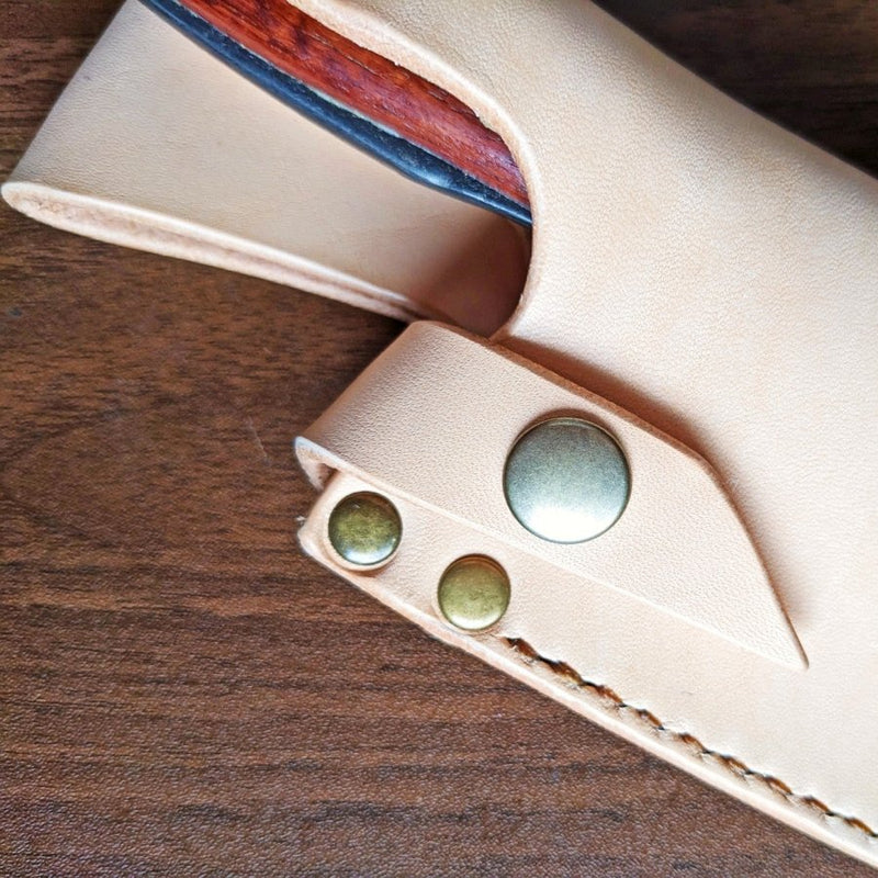 Leather case for Kurotori Butcher Knife on wooden background