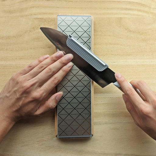 KISEKI Knife Attachment for Sharpening on a KISEKI Santoku Knife over a KISEKI Diamond Whetstone