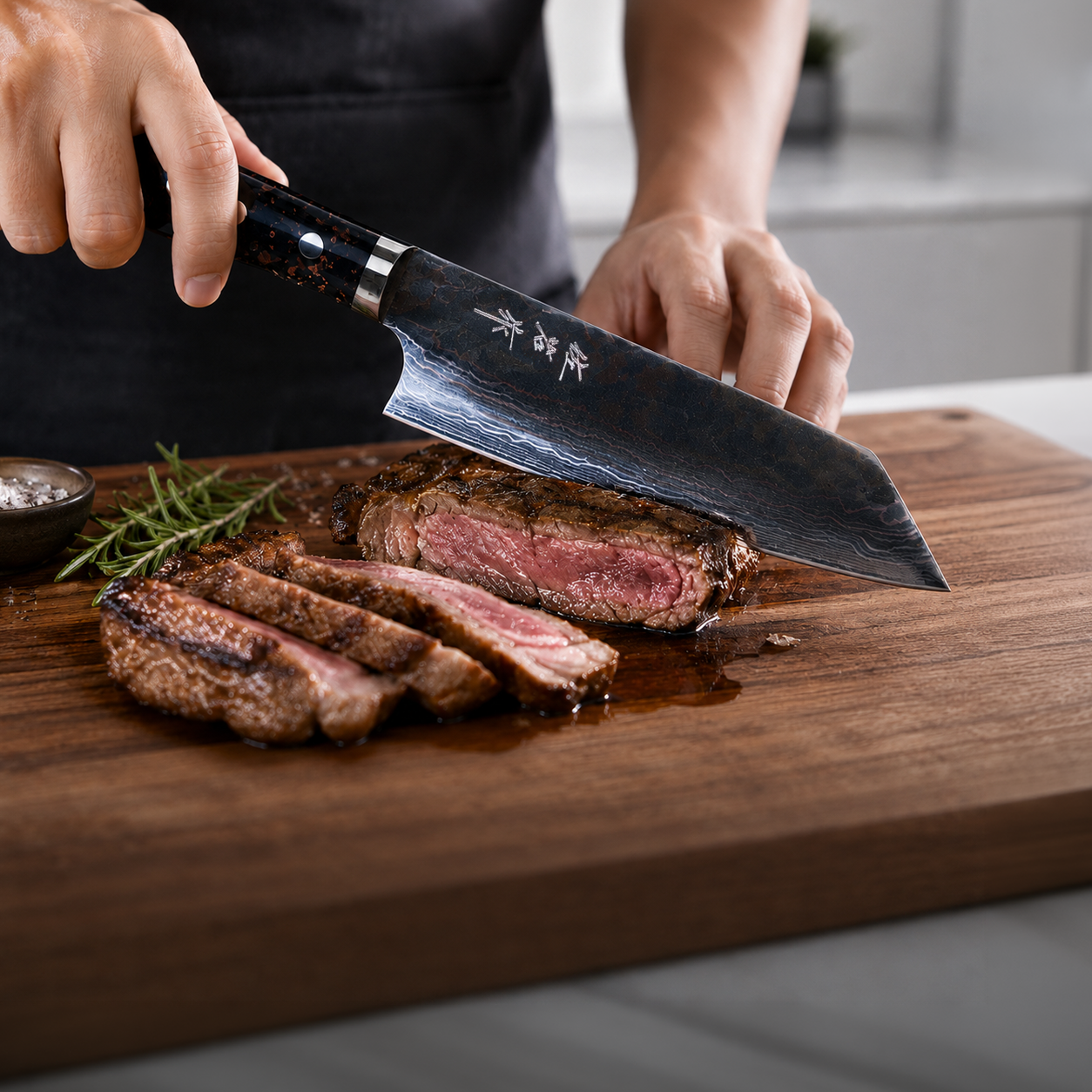 Closeup of a hand holding a premium kitchen knife cutting meat on a cutting board