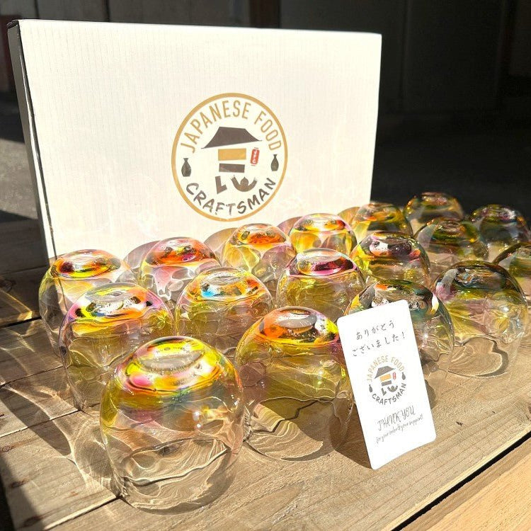 Collection of 18 Handcrafted Round Rainbow Glasses by Soejima Glassware displayed upside down in front of white Japanese Food Craftsman box