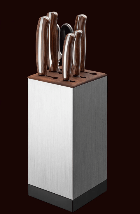 Knives in NAGOMI Knife Stand by Mitsuboshi Cutlery on a brown background