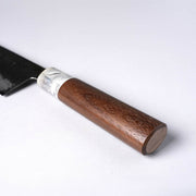 Closeup of the walnut handle with white and grey ferrule for a Miwa Hamono knife