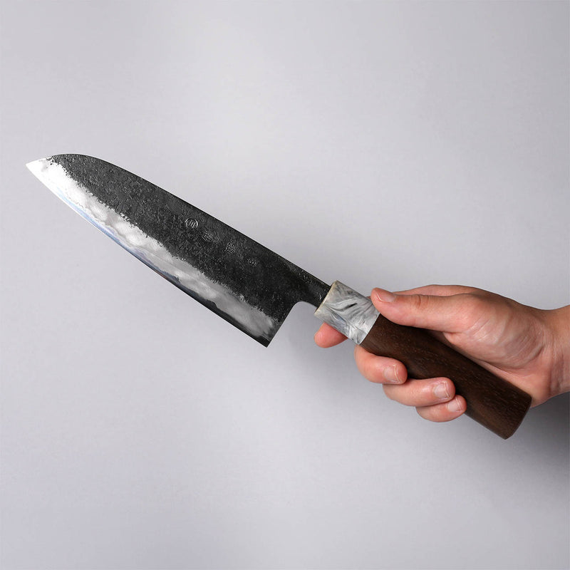 Hand holding a Miwa Hamono Kurouchi Aogami No.1 Gyuto Knife 165mm