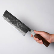 Hand holding a Miwa Hamono Kurouchi Aogami No.1 Nakiri Knife 185mm