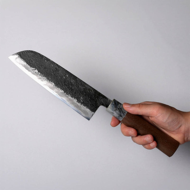 Hand holding a Miwa Hamono Kurouchi Aogami No.1 Santoku Knife 165mm