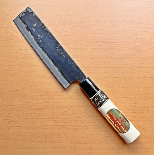 Kurouchi Nakiri Knife 155mm crafted by Shigemitsu Hamono diagonal on wood background (front side)