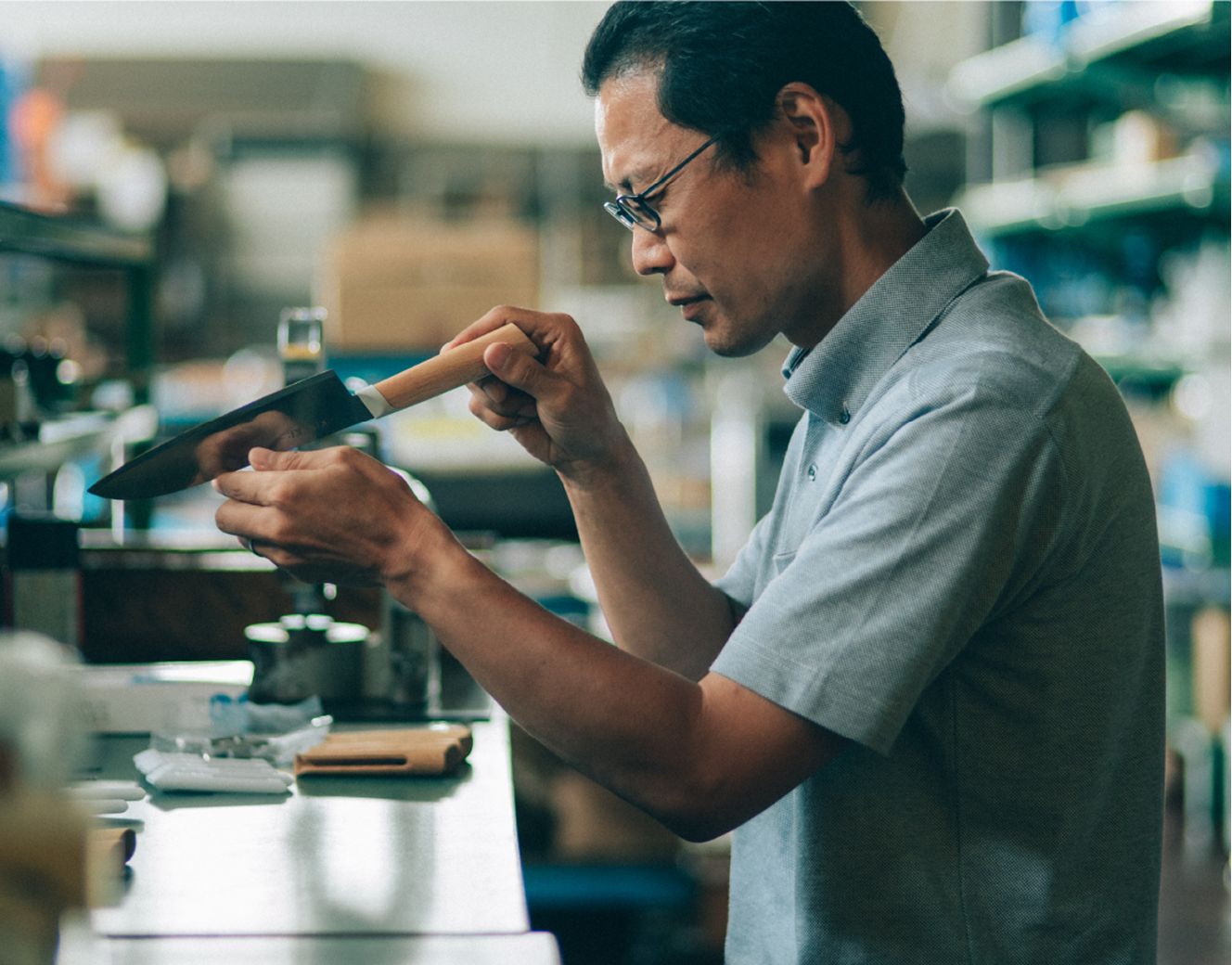 Fukuda Hamono craftsmen checking a Kiseki Santoku knife inside the workshop