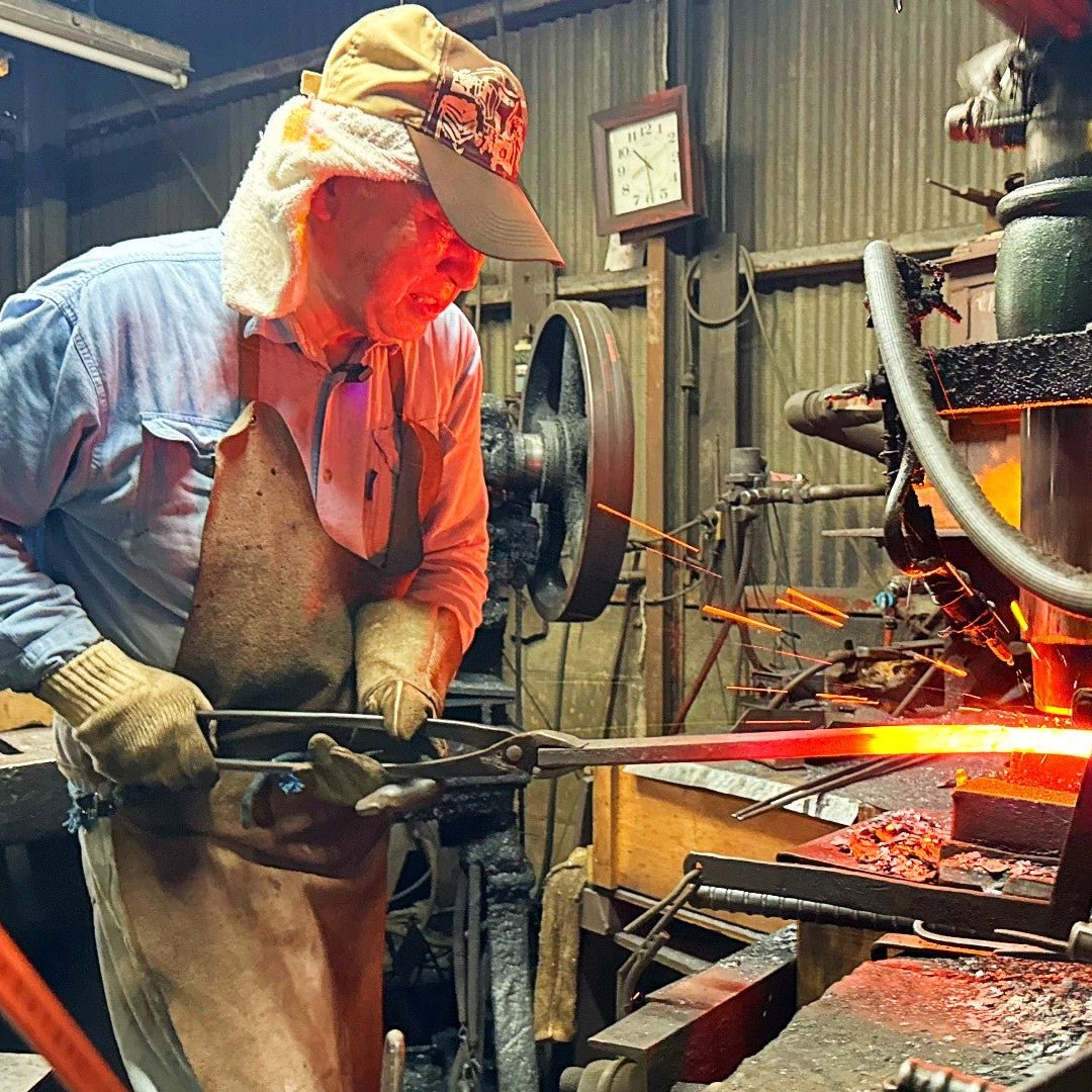 Nakamura Hamono craftsman hammering the blade