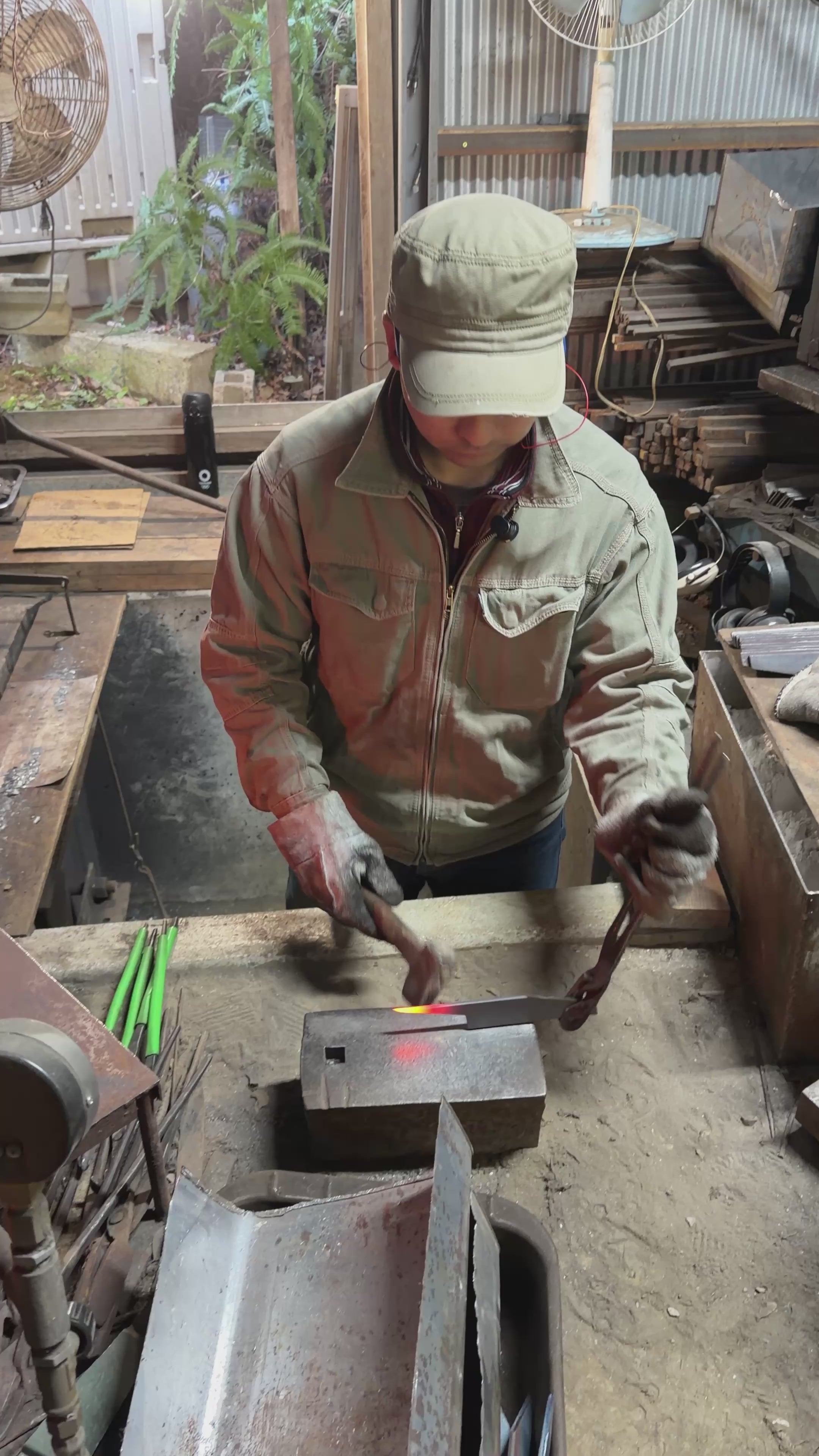 Kyohei Shindo shaping and hammering a blade in his workshop