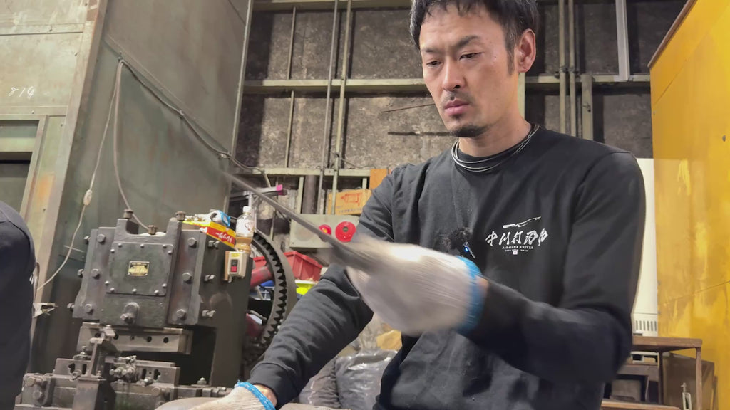 Satoshi Nakagawa Inspecting blades in his workshop Nakagawa Knives