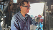 Master swordsmith Ueda Sukesada inside Bizen Osafune workshop taking a hot blade from the forge to hammer it while sparks fly.