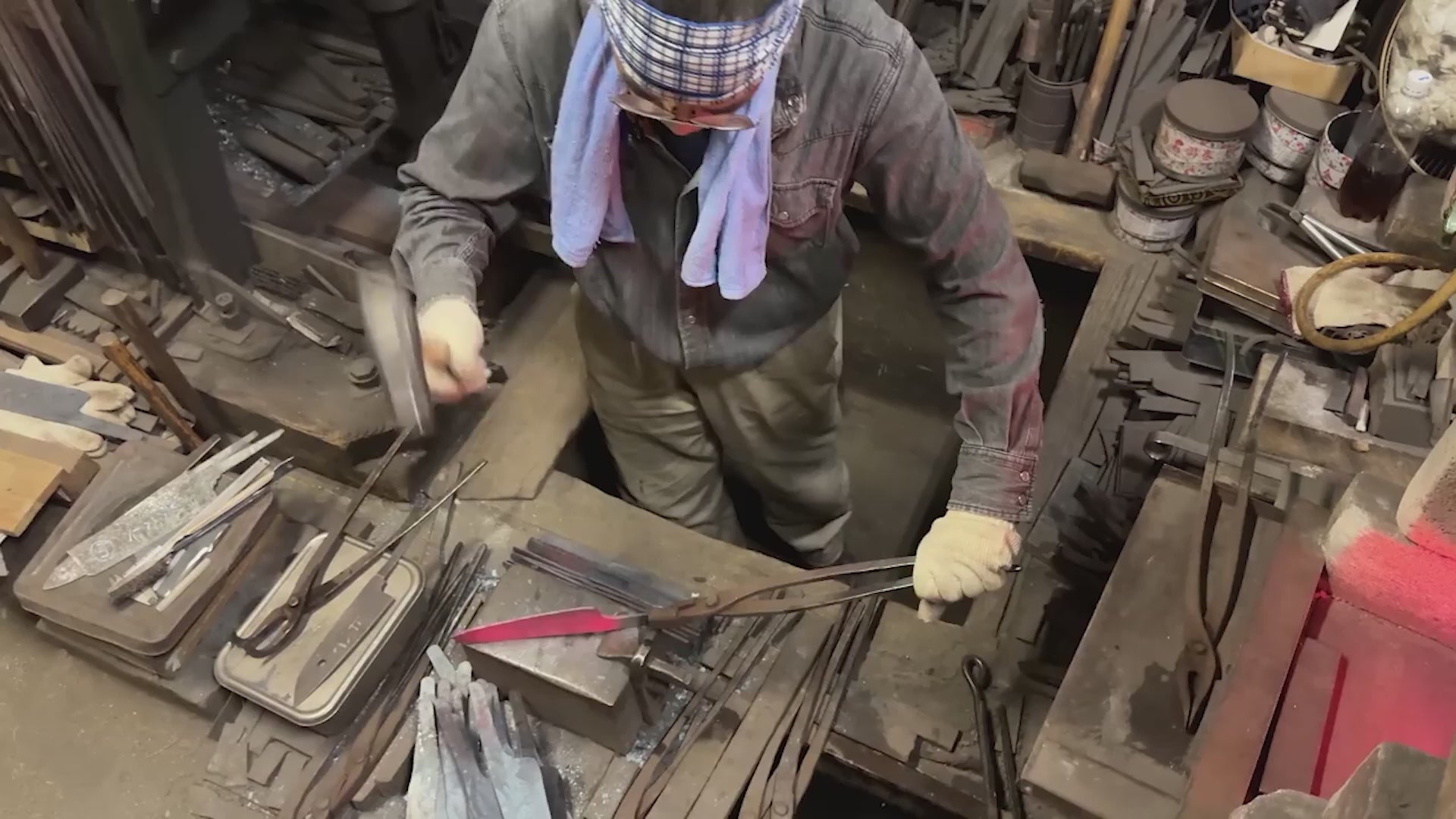 Yamawaki Blacksmith hammering a blade in the workshop
