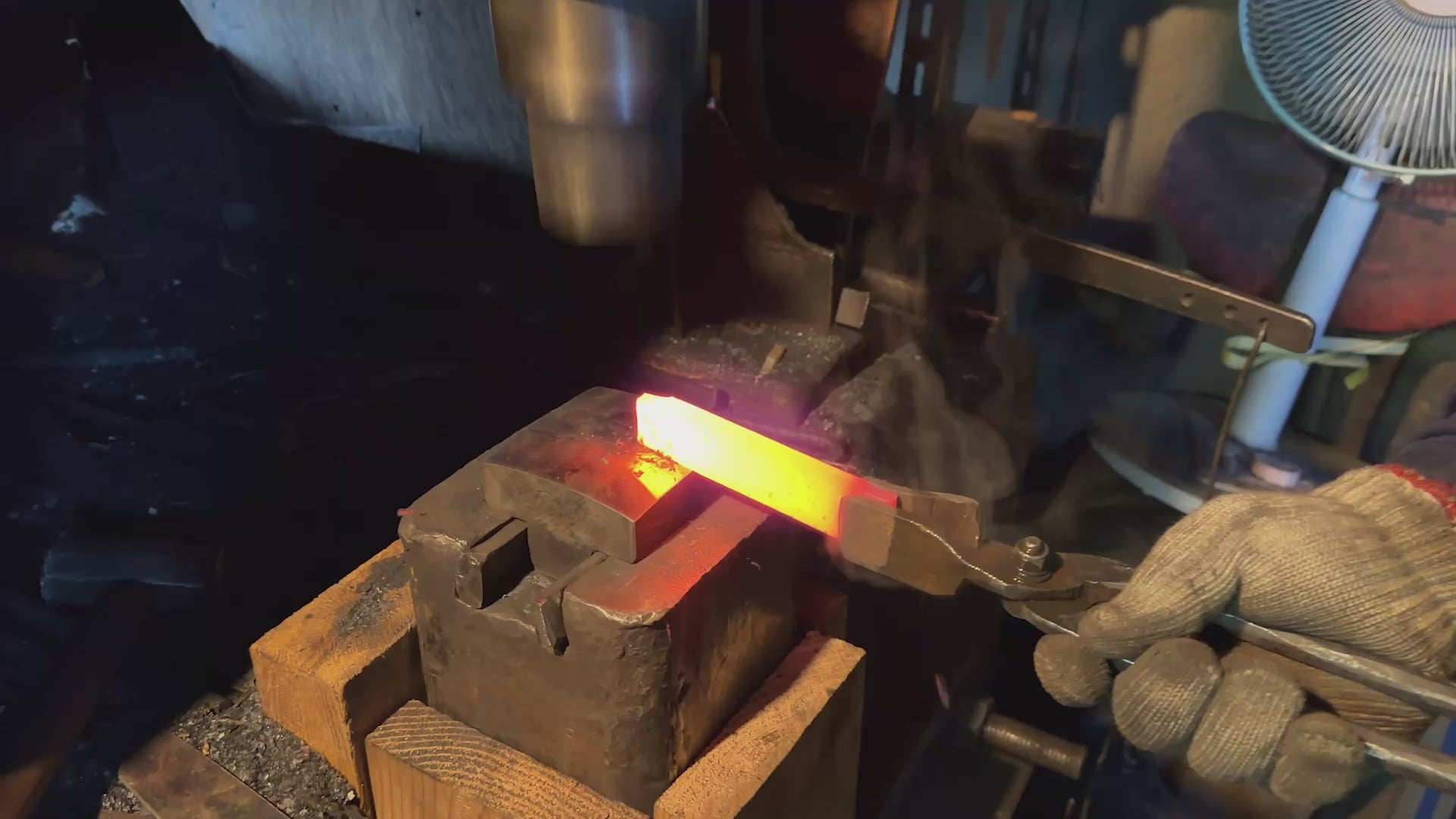 Kajihara Hamono master artisan hammering a heated knife balde