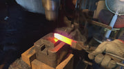 Kajihara Hamono master artisan hammering a heated knife balde