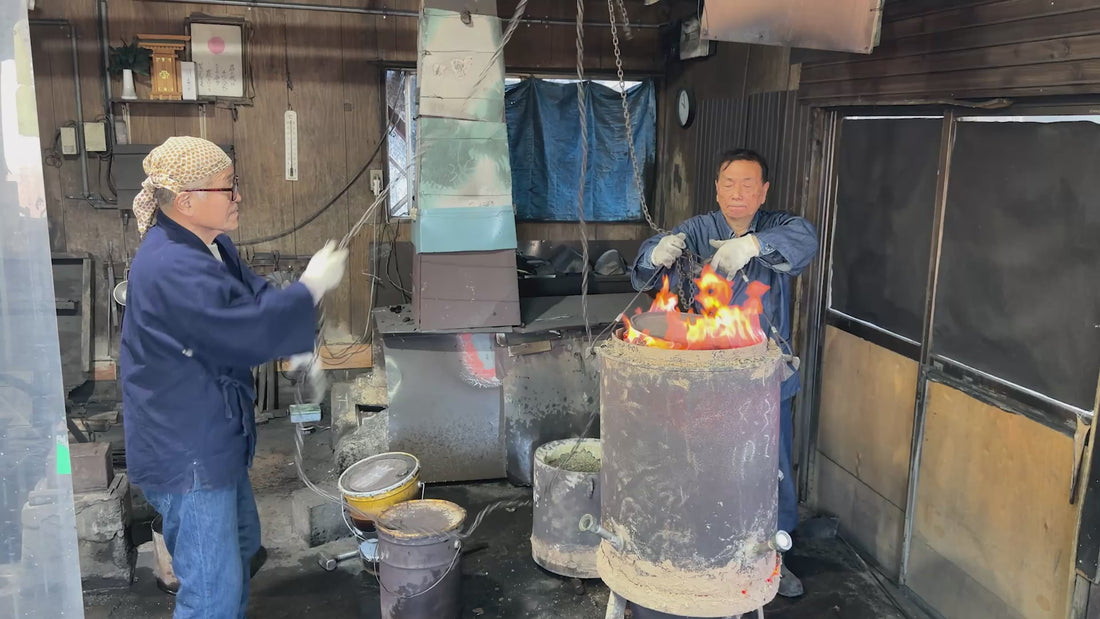 Ueta Norihito (Sukesada) and his fellow  blacksmith inside Bizen Osafune workshop working with hot tanks of metal