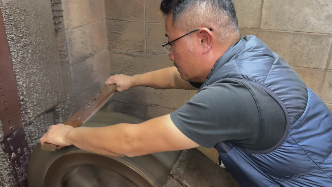 Makoto Tadokoro, from Tadokoro Hamono, sharpening a blade