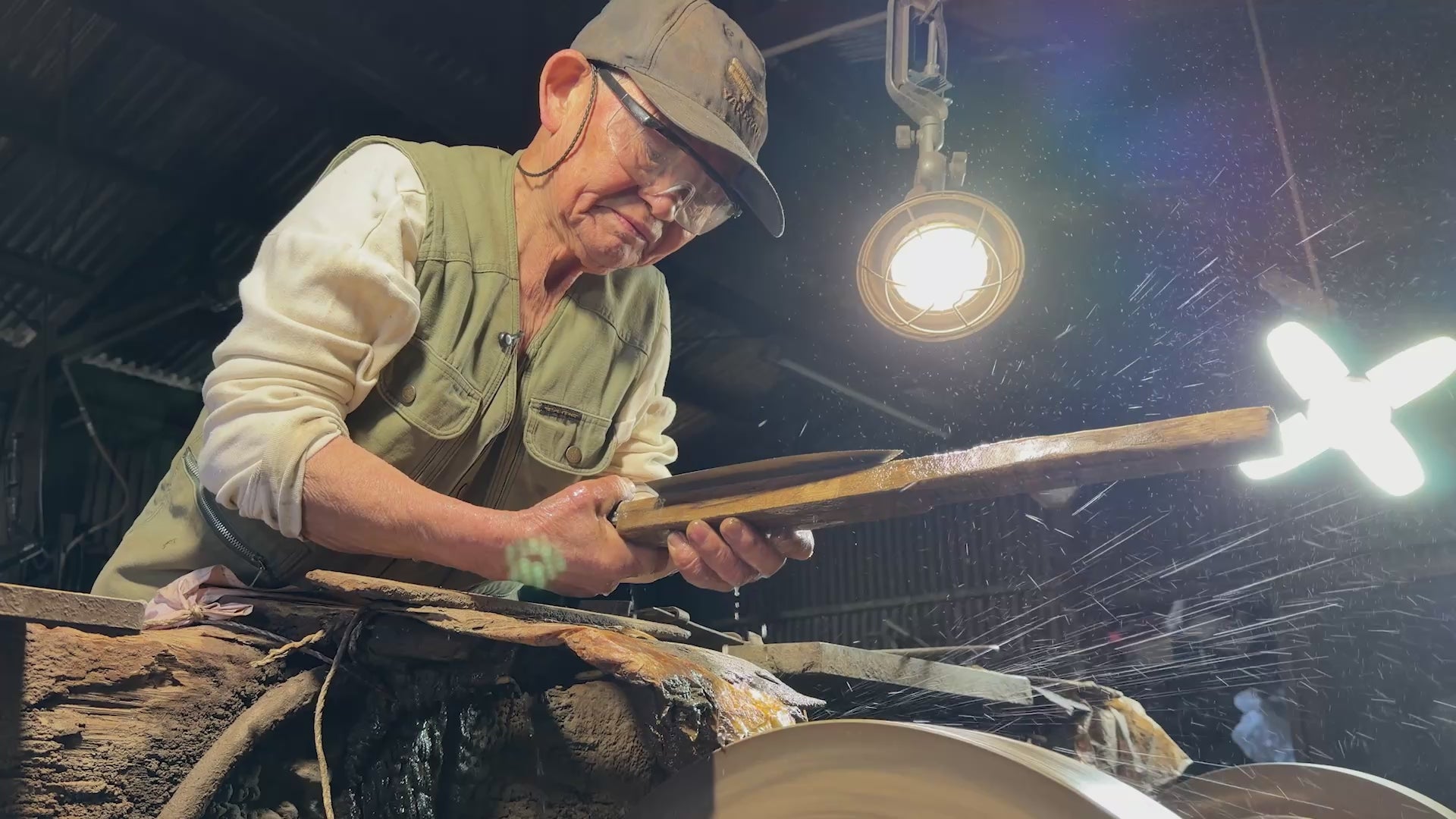 Toshio Nakamura polishing a balde inside the Nakamura Blacksmith workshop