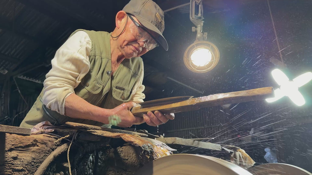 Toshio Nakamura polishing a balde inside the Nakamura Blacksmith workshop