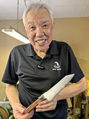 Seki Kikusui Cutlery holding VG-10 stainless steel KIRINAMI Kiritsuke Bunka in his workshop